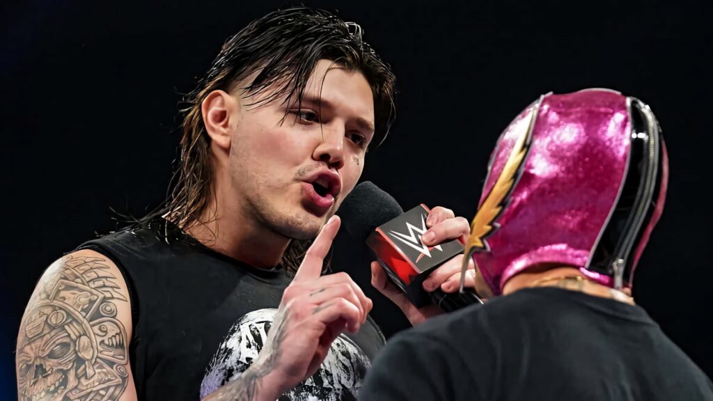 Dominik Mysterio faces Rey Mysterio in WWE ring intense rivalry vibrant wrestling wallpaper