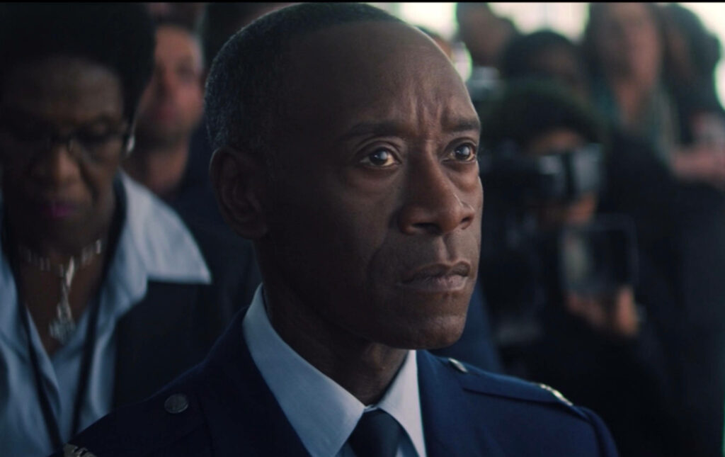 Don Cheadle Avengers wallpaper in formal military uniform with serious expression and blurred crowd background