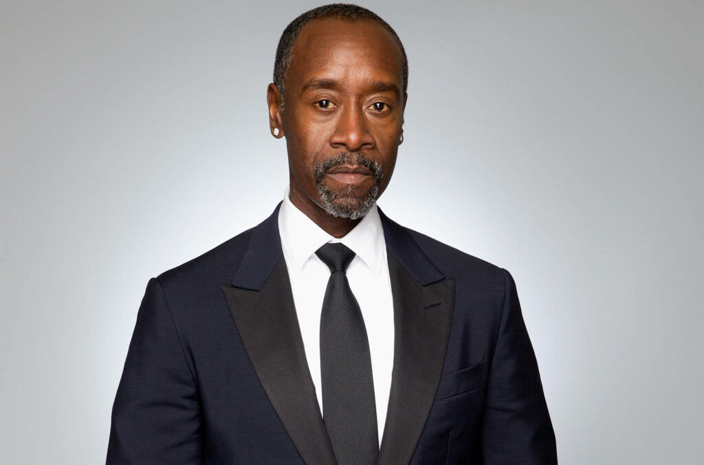 Don Cheadle in classic dark suit and tie confident professional portrait gray studio background Wallpaper