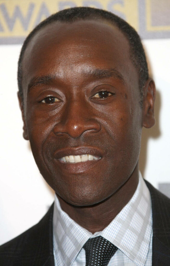 Closeup of Don Cheadle in sharp suit with expressive face and detailed skin tone wallpaper background
