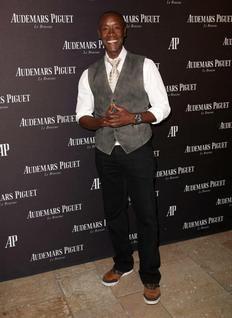 Don Cheadle in stylish vest white shirt tie and brown shoes at Audemars Piguet event backdrop Wallpaper