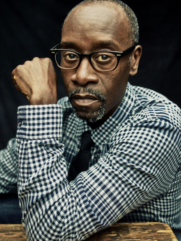 Don Cheadle stylish nerdy look glasses checkered shirt dark background soft lighting portrait Wallpaper