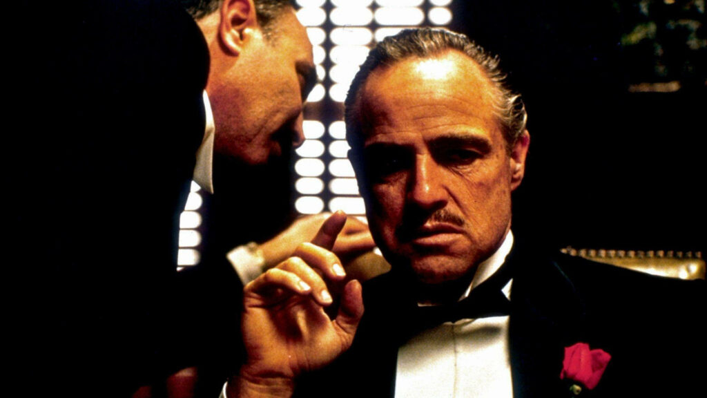 Iconic Godfather Wallpaper: Don Vito Corleone in Commanding Pose