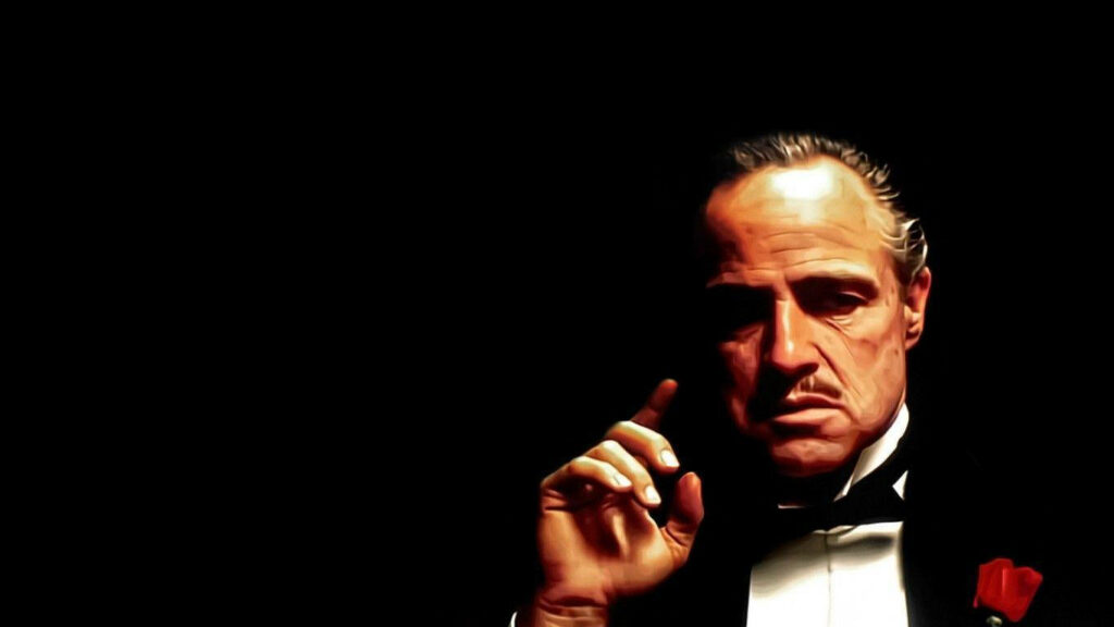 Iconic Don Vito Corleone Wallpaper: Classic Bow Tie & Suit Design