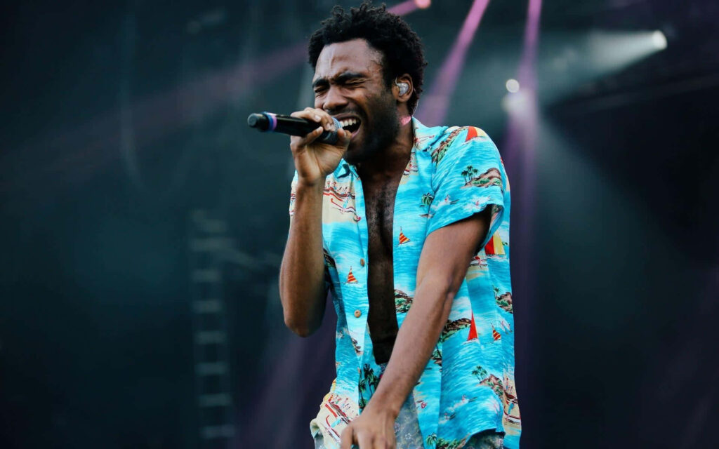 Electrifying Donald Glover Live: Tropical Shirt Wallpaper Background