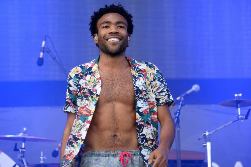 Vibrant Wallpaper: Donald Glover Live on Stage, Full of Energy