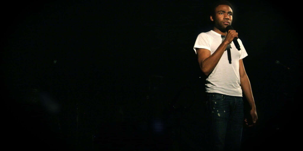 Donald Glover On Stage: Casual Performance in White T-Shirt & Jeans Wallpaper