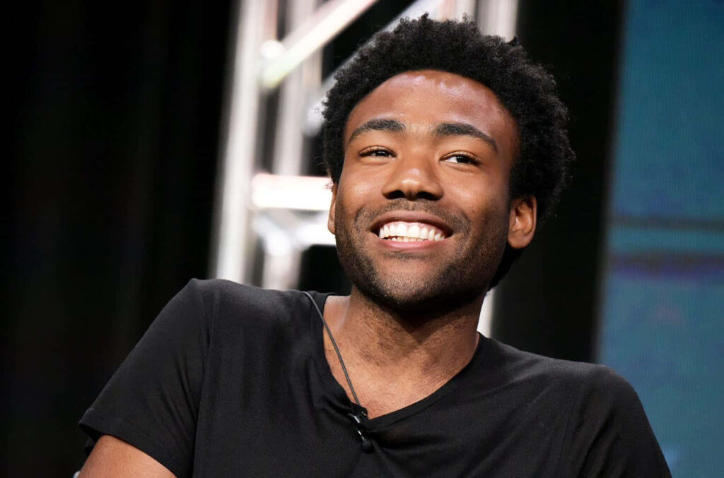 Charming Donald Glover Smiling in Interview - Cheerful Wallpaper