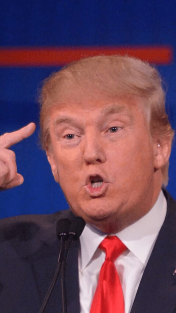 Donald Trump pointing to head during speech vivid blue background expressive gesture wallpaper