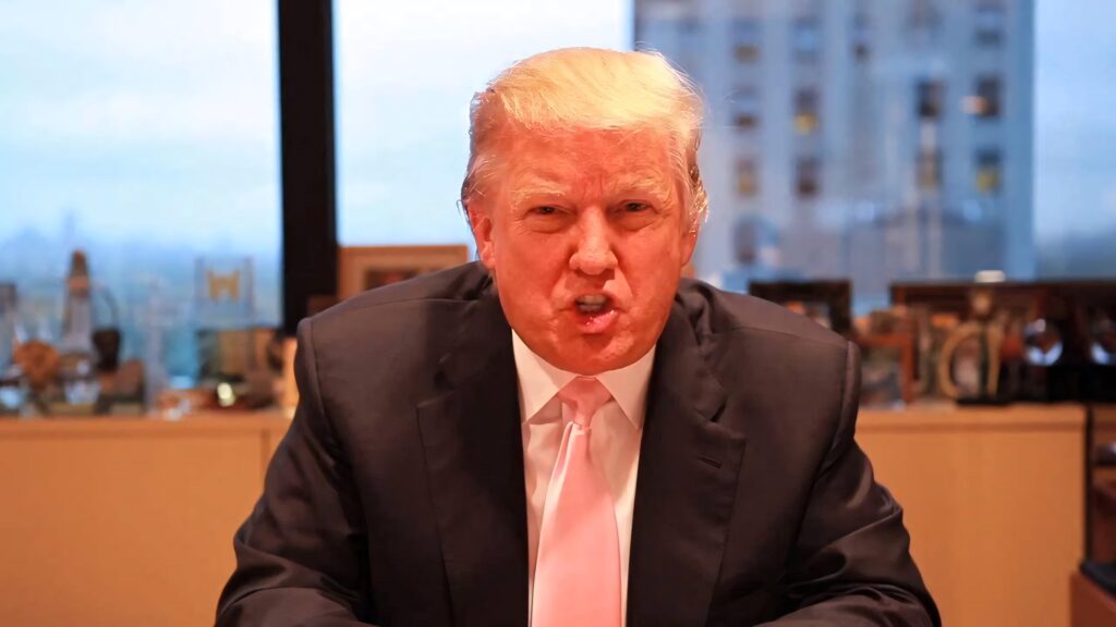 Donald Trump shouting in office with city skyline background intense professional atmosphere Wallpaper