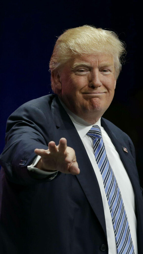 Donald Trump in dark suit waving goodbye with confident expression realistic wallpaper background