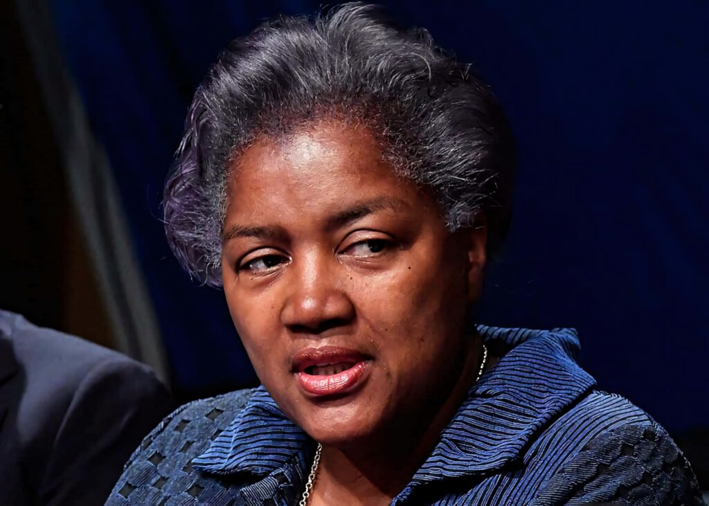 Donna Brazile high-resolution portrait professional attire deep blue background American politics Wallpaper