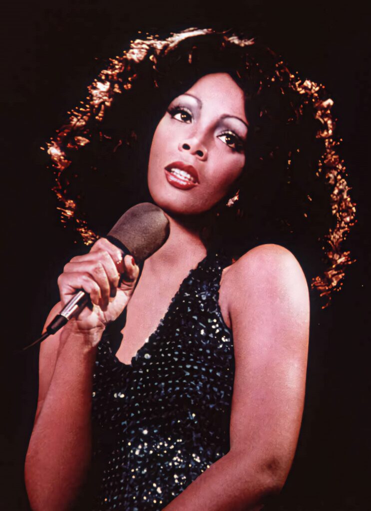Donna Summer disco era wallpaper showing iconic style sparkling outfit and expressive pose