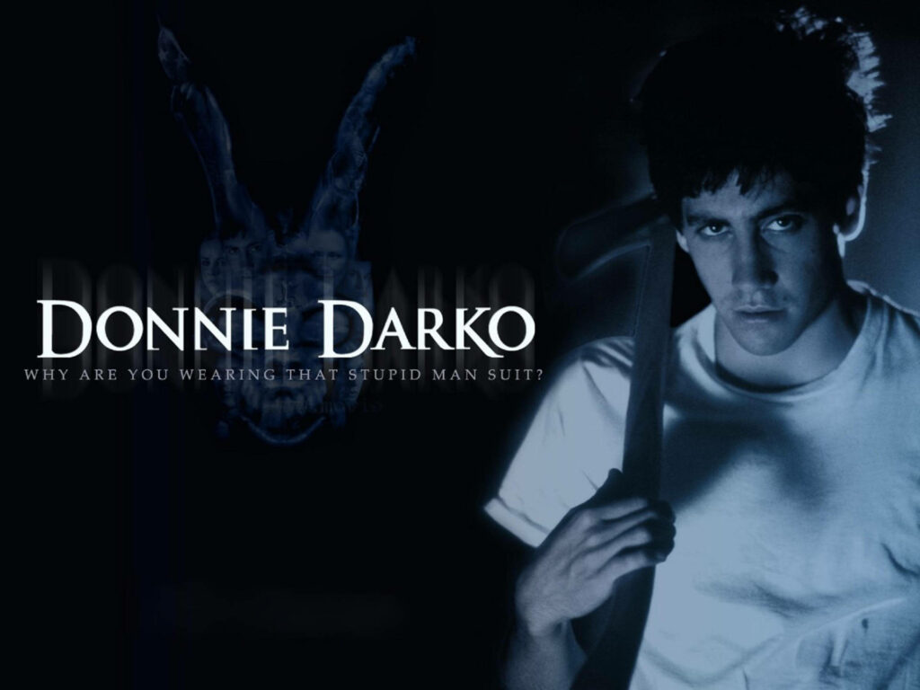Donnie Darko wallpaper with Jake Gyllenhaal holding axe and shadowy surreal rabbit in blue tones