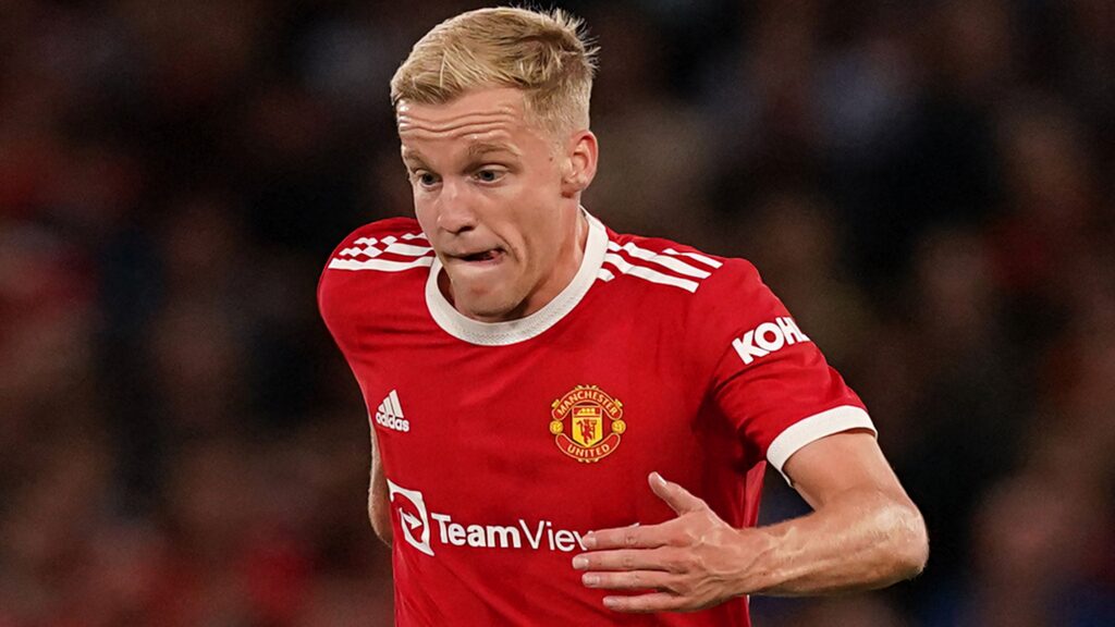 Donny van de Beek intense close up running in Manchester United red kit showing determination Wallpaper