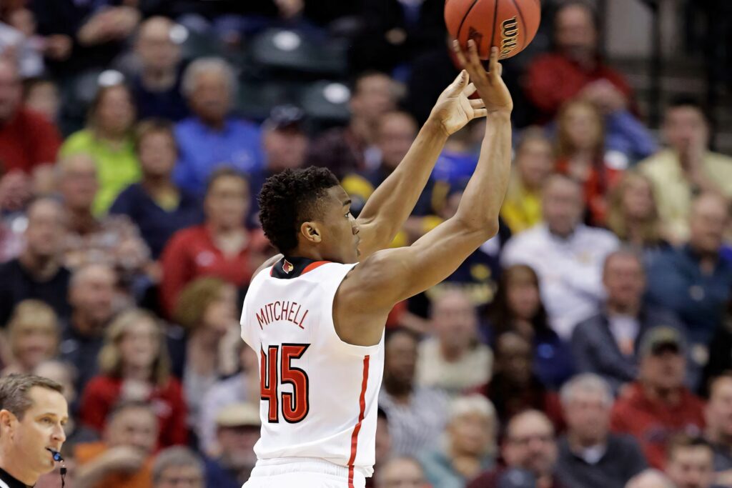 Donovan Mitchell jumping for a shot in number 45 jersey vibrant basketball action wallpaper