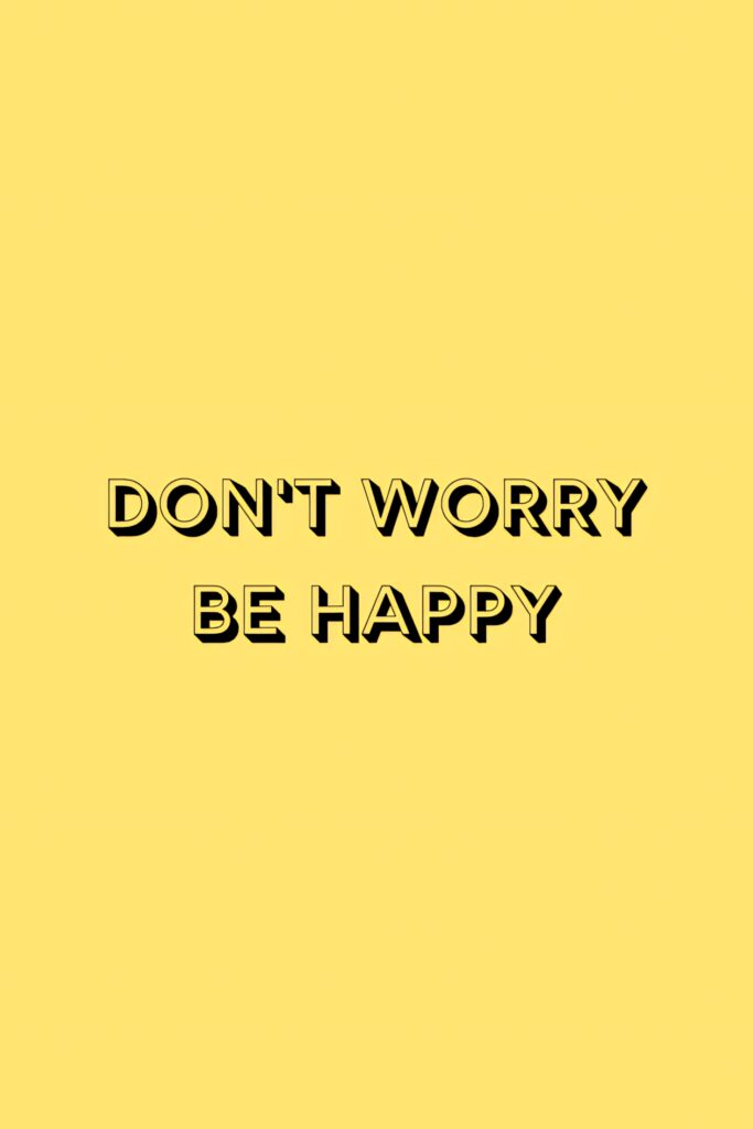 Inspirational Dont Worry Be Happy wallpaper with bold black text and bright yellow background