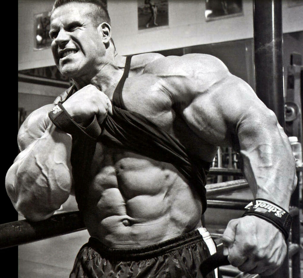 Bodybuilder Dorian Yates displaying massive muscular physique and intense gym pose wallpaper