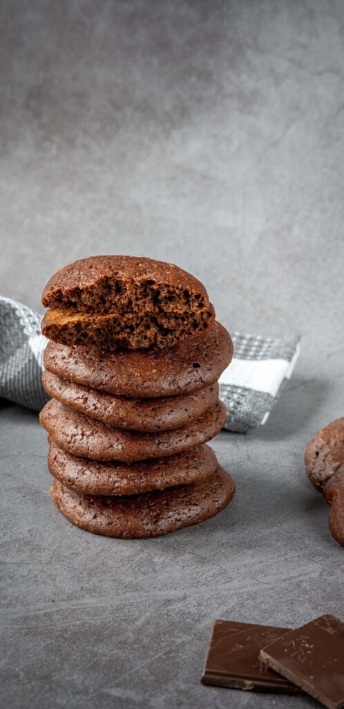 Essence of Double Chocolate Chip Cookies on a Sleek Concrete Canvas Wallpaper