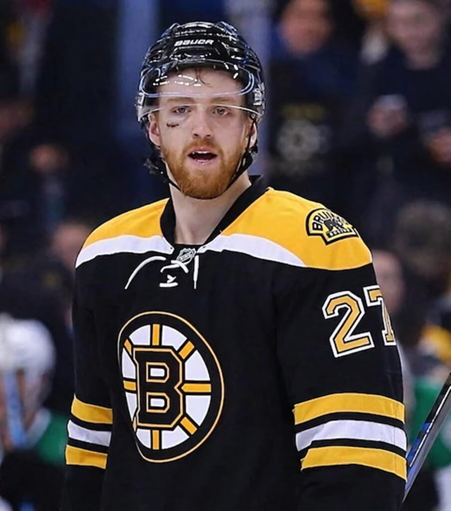Dougie Hamilton Boston Bruins player in black gold uniform intense NHL gameplay action wallpaper
