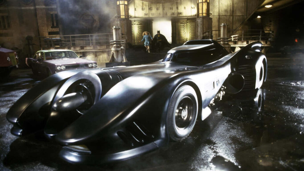 Legendary Batmobile, an iconic backdrop from DC Comics' Batman series – Download in high resolution (1366x768) Wallpaper
