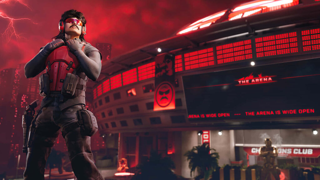 Dr DisRespect in tactical vest and sunglasses stands in red-lit futuristic gaming arena with stormy sky Wallpaper