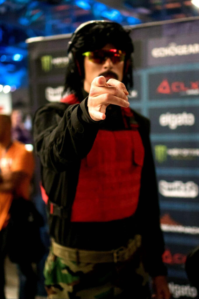 Dr DisRespect in iconic red vest black shirt aviator sunglasses headset dynamic gaming wallpaper