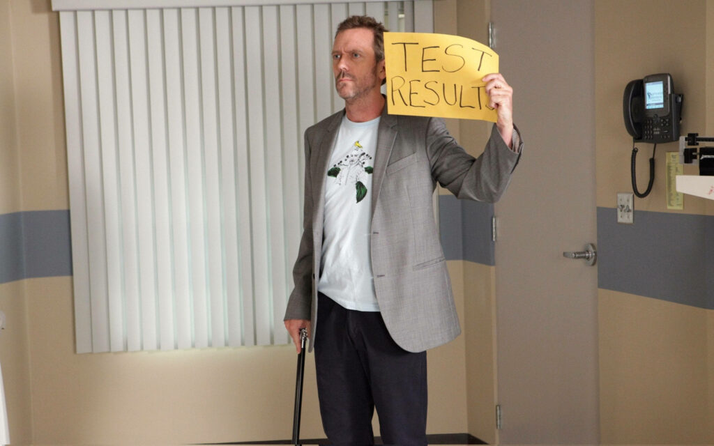 Dr. House Wallpaper: Witty Test Result Sign in Hospital Setting
