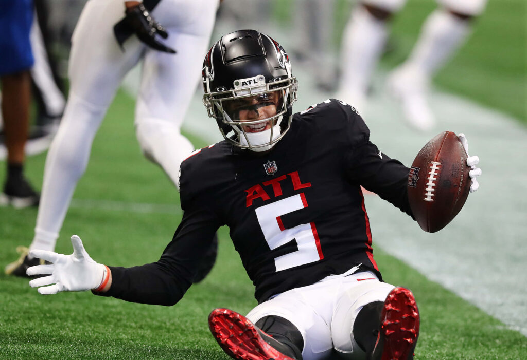 Atlanta Falcons wide receiver Drake London celebrates a catch in black and red uniform NFL wallpaper