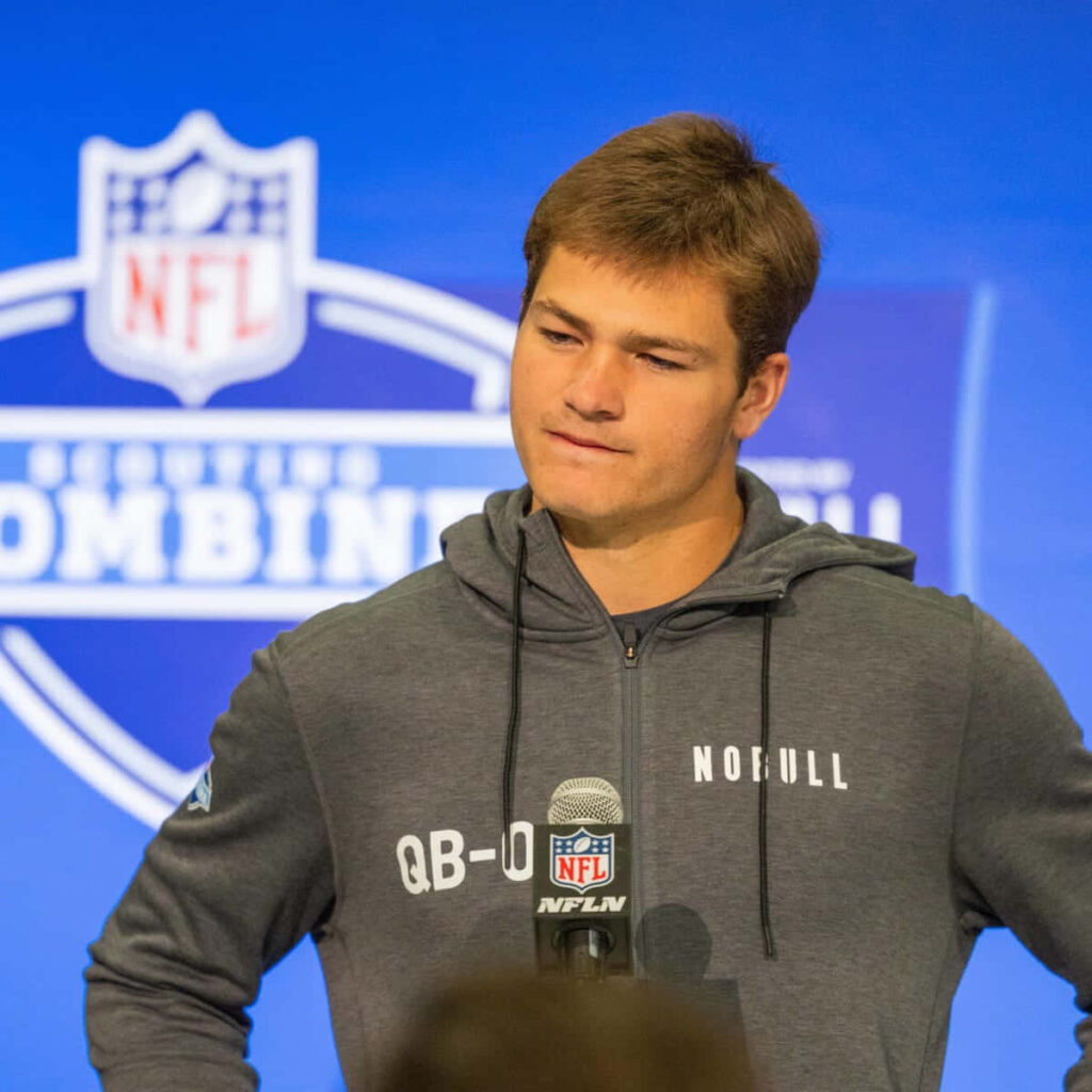 Drake Maye at NFL Combine press conference wearing gray hoodie confident quarterback prospect Wallpaper