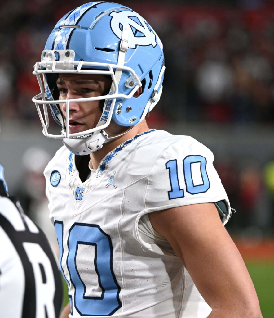 Drake Maye in number 10 North Carolina football uniform focused on field dynamic sports wallpaper