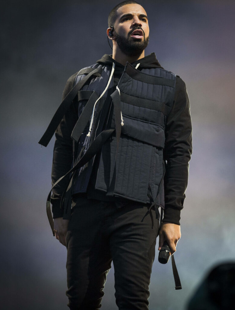 Drake on Stage: Passionate Concert Performance Wallpaper Background