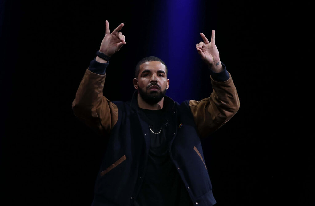 Drake Wallpaper: Confident Inspiration Under Focused Lighting