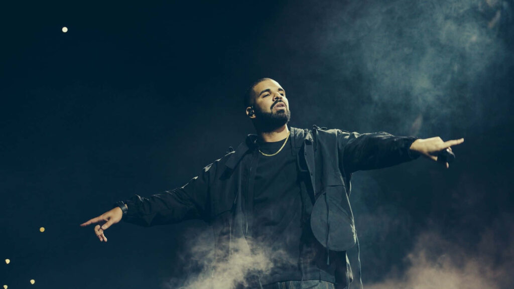 Drake's Captivating Stage Presence Wallpaper - Confident Performance