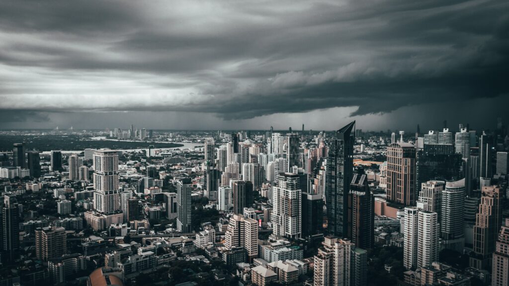 Moody Aerial Cityscape Wallpaper: Skyscrapers & Overcast Sky