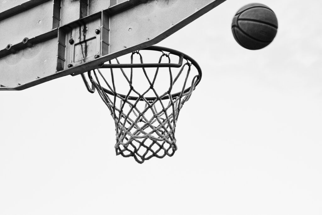 Dynamic Black and White Basketball Wallpaper: Iconic Mid-Air Shot