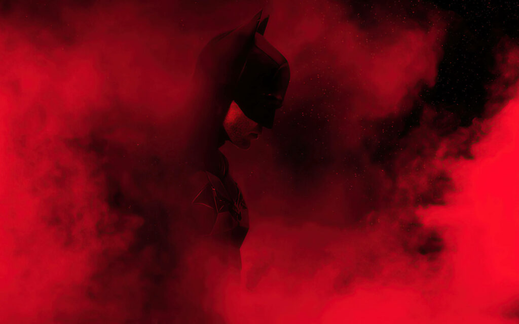 Dramatic Entrance: Batman Emerges from Red Smoke, Ideal Phone Wallpaper!