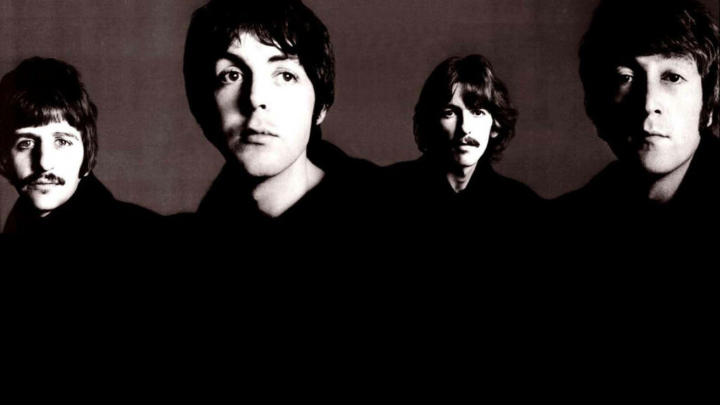 Iconic Beatles Wallpaper: Dramatic Dark Mood Background Design