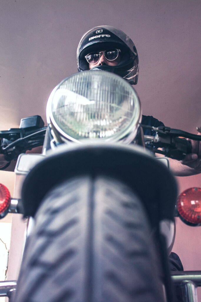 Dramatic Worm's-Eye View Bike Rider Wallpaper - Adventure Awaits