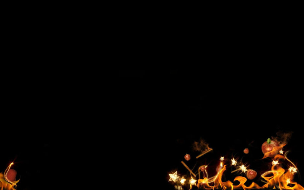 Intense Black Background with Vivid Dancing Flames and Sparks Wallpaper