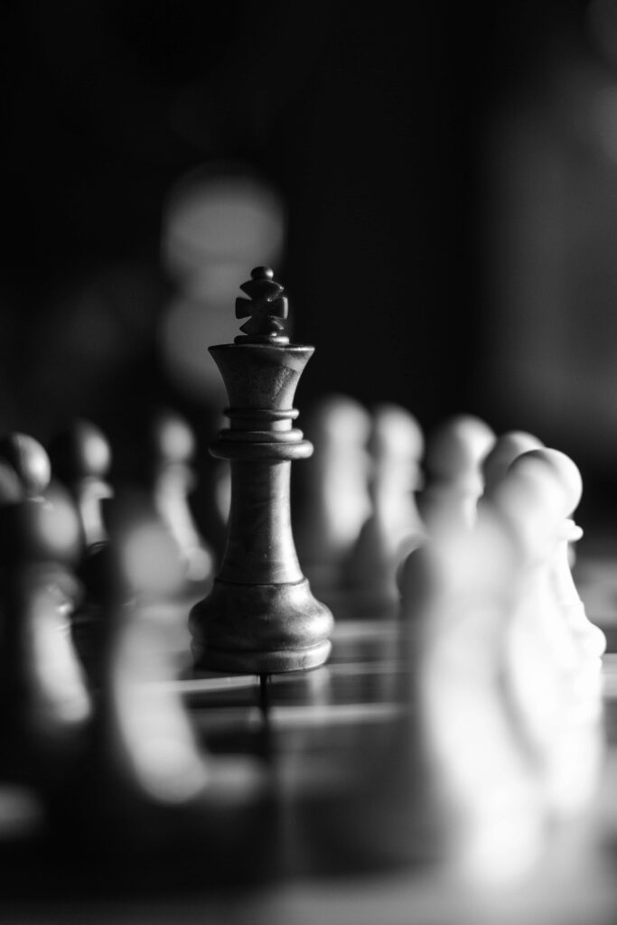 Monochrome Chessboard Wallpaper: King in Focus for Strategic Tension