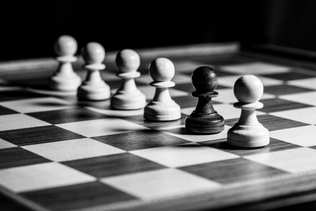 Chess Pawns on Board: Dramatic Black & White Wallpaper Background