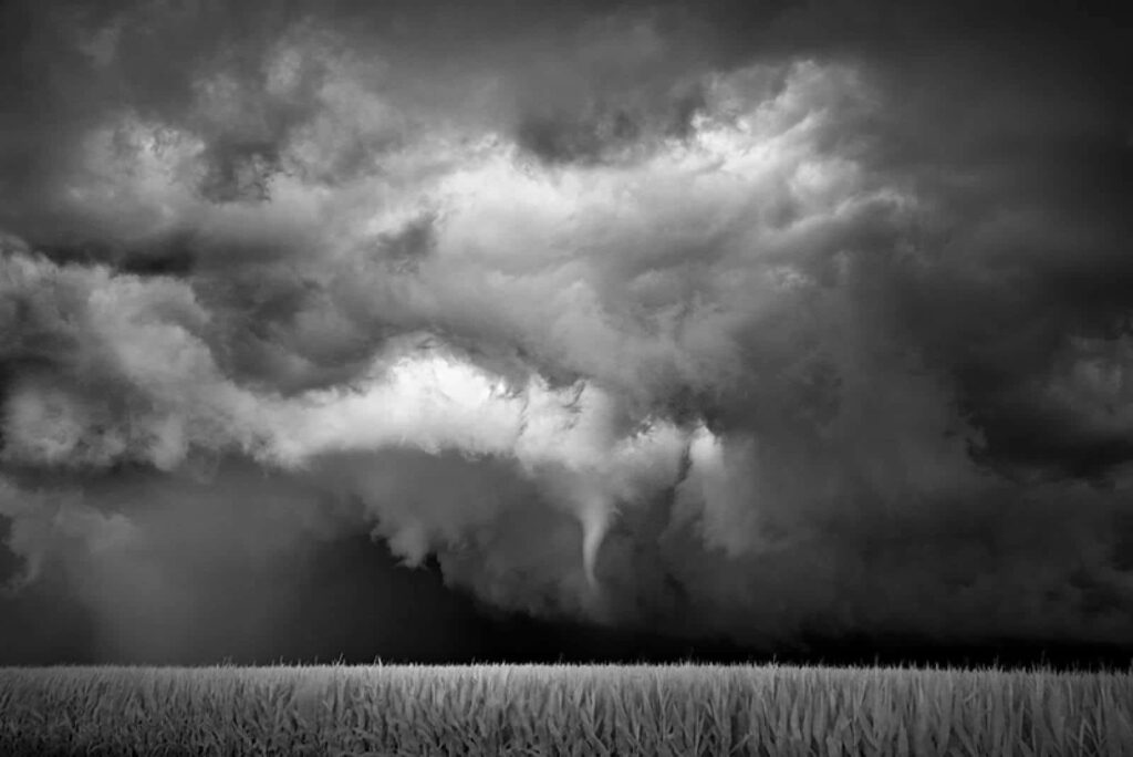 Dramatic Black and White Storm Wallpaper: Intense Sky Over Field