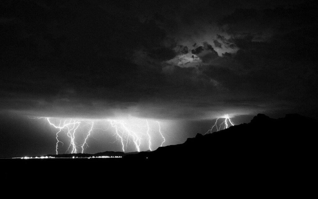 Dramatic Black and White Thunderstorm Wallpaper with Lightning