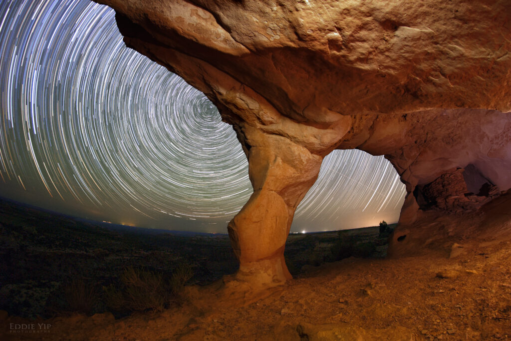 Dramatic canyon rock with vibrant night sky star trails long exposure natural wallpaper background