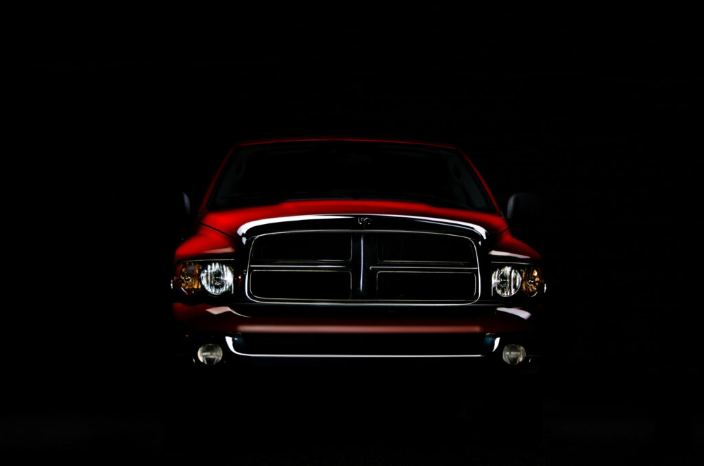 Car Wallpaper: Dramatic Front View with Bold Ram Grille Design
