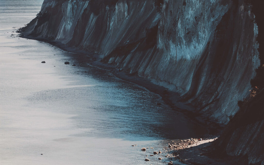 Stunning Cliffs and Serene Coastline Wallpaper: Nature's Power
