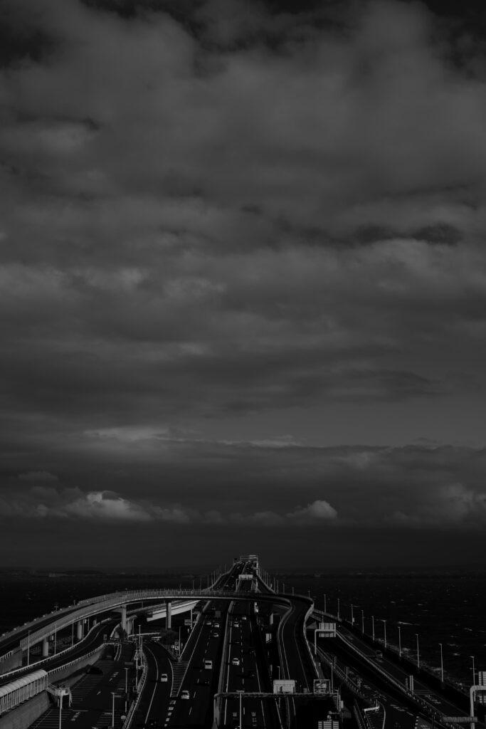 Dark Highway HD Wallpaper: Mysterious Road Under Ominous Clouds