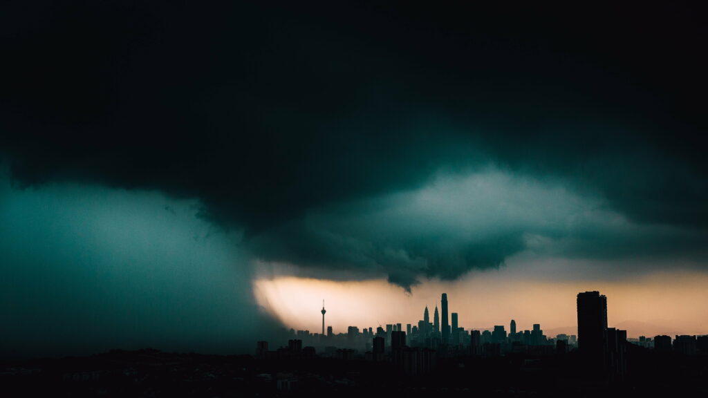 Stormy Cityscape HD Wallpaper: Dark Clouds & Silhouetted Buildings