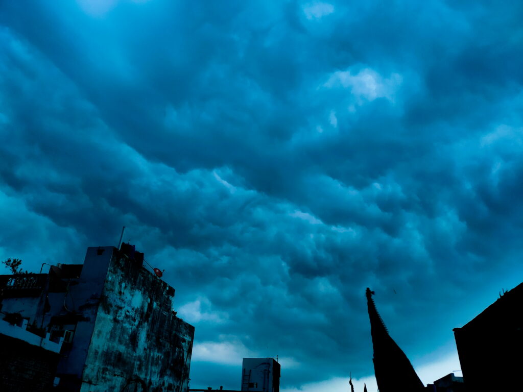 Intense HD Wallpaper: Dramatic Sky & Silhouetted Buildings Background